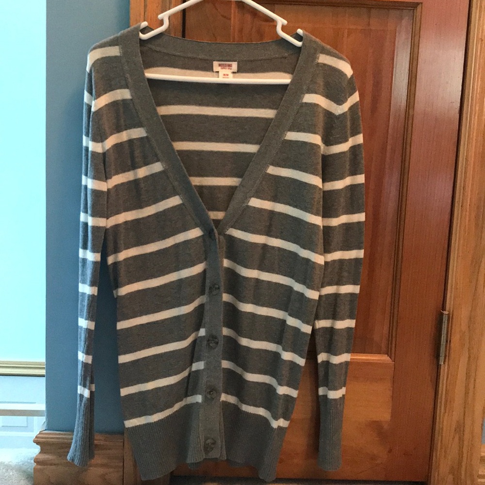 Size Medium. Sweater with buttons.